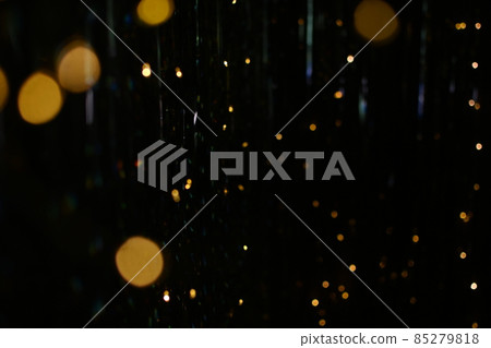 golden bokeh lights and highlights on a black background. 85279818