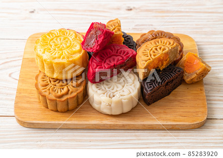 colourful Chinese moon cake on wood plate colourful Chinese moon cake on wood plate 85283920