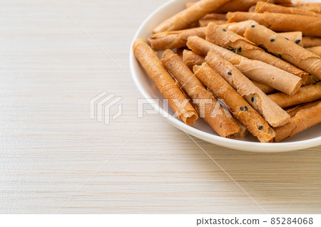 crispy coconut roll on plate 85284068