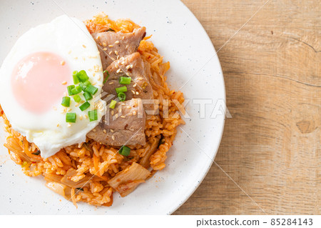 Kimchi fried rice with fried egg and pork Kimchi fried rice with fried egg and pork 85284143