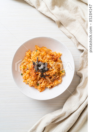kimchi fried rice with seaweed and white sesame 85284147