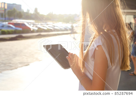 Woman browsing tablet in business center Woman browsing tablet in business center 85287694