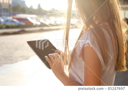 Woman browsing tablet in business center Woman browsing tablet in business center 85287697