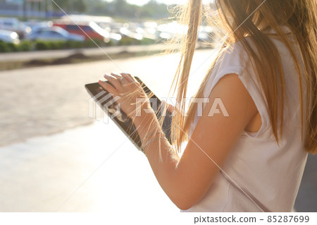 Woman browsing tablet in business center Woman browsing tablet in business center 85287699