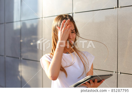 Woman browsing tablet in business center 85287795