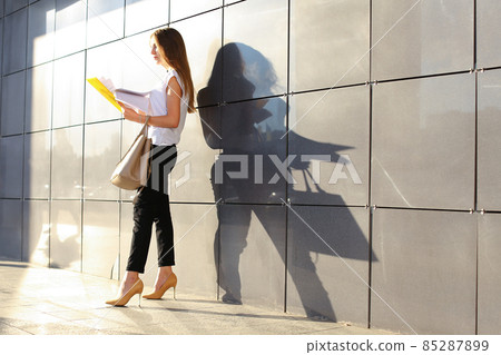 Business woman girl work business center look at documents Business woman girl work business center look at documents 85287899