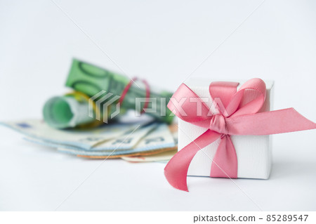 Gift present with money euro. Buying gifts for holidays. Online shopping concept. Holiday Sale Gift present with money euro. Buying gifts for holidays. Online shopping concept. Holiday Sale 85289547