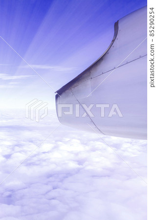 A wonderful view from the window of an airplane: Blue-purple sky and light A wonderful view from the window of an airplane: Blue-purple sky and light 85290254