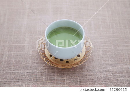 Steaming hot matcha latte table 85290615