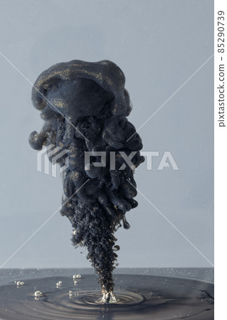 Explosion of colored, fluid and neoned liquids on black studio background with copyspace Explosion of colored, fluid and neoned liquids on black studio background with copyspace 85290739