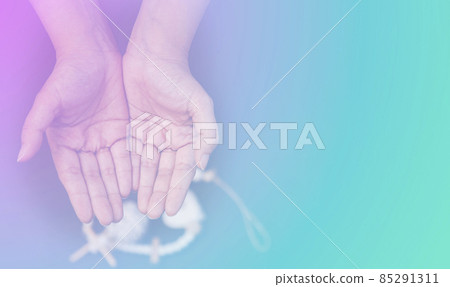 Woman's hand praying and worship to GOD Using hands to pray in religious beliefs and worship christian in the church or in general locations in vintage color tone or copy space. 85291311