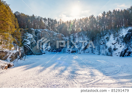 Sheer cliffs and rocks around the Talc quarry in winter in Russia in the town of Sysert, near Yekaterinburg. 85291479