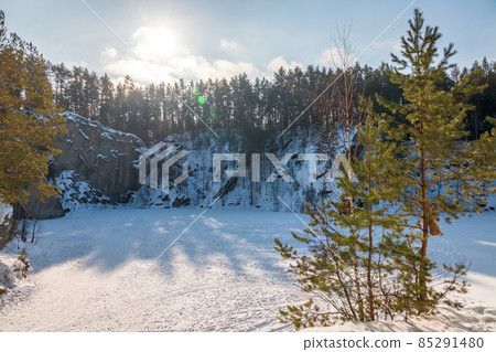 Sheer cliffs and rocks around the Talc quarry in winter in Russia in the town of Sysert, near Yekaterinburg. 85291480