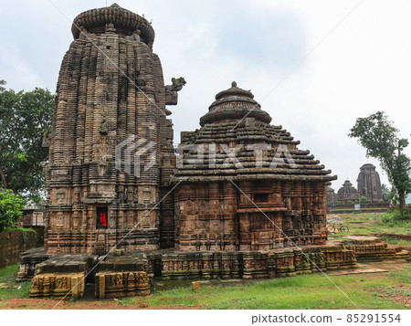 Side facade of view of Sukasari Temple, Bhubaneswar, Odisha, India. Built in sandstone with carvings of human figures, deities, scroll work and floral motifs on walls. 85291554