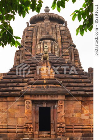 Jagamohana or sanctuary doorway with nagas holding garlands and below lions on elephants. Rajarani temple a 11th century Odisha style temple constructed dull red and yellow sandstone., Bhubaneswar, Jagamohana or sanctuary doorway with nagas holding garlands and below lions on elephants. Rajarani temple a 11th century Odisha style temple constructed dull red and yellow sandstone., Bhubaneswar, 85291611