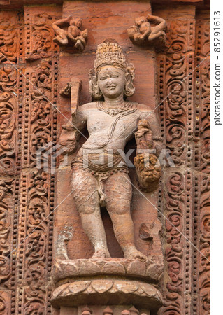 Sculpture of Agnidev the God of fire on Rajarani Temple. 11th century Odisha style temple constructed dull red and yellow sandstone, Bhubaneswar, Odisha, India. 85291613