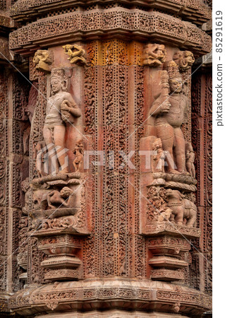 Carved stone sculpture of Lord Yama at Rajarani Temple. 11th century Odisha style temple constructed dull red and yellow sandstone, Bhubaneswar, Odisha, India. Carved stone sculpture of Lord Yama at Rajarani Temple. 11th century Odisha style temple constructed dull red and yellow sandstone, Bhubaneswar, Odisha, India. 85291619