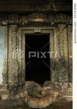 Jain Cave Temple carved entrance at foothills of Tringalwadi fort, Nashik, Maharashtra, India. Jain Cave Temple carved entrance at foothills of Tringalwadi fort, Nashik, Maharashtra, India. 85291689