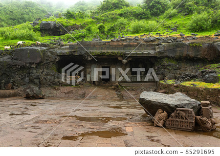 Jain Cave Temple with a beautifully carved entrance at foothills of Tringalwadi fort, Nashik, Maharashtra, India. 85291695
