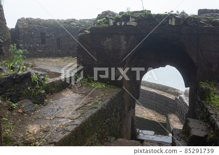 Inside view of top entrance gate of the fort during rain, Tikona Fort, Pune, Maharashtra, India. Inside view of top entrance gate of the fort during rain, Tikona Fort, Pune, Maharashtra, India. 85291739