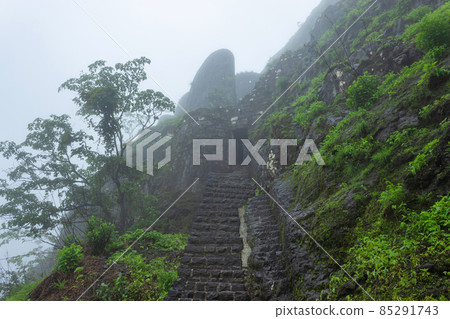 View of top entrance gate of the fort during rain, Tikona Fort, Pune, Maharashtra, India. View of top entrance gate of the fort during rain, Tikona Fort, Pune, Maharashtra, India. 85291743