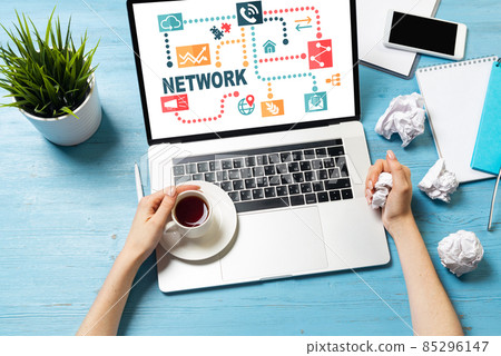 Developer sitting at desk and working with laptop Developer sitting at desk and working with laptop 85296147