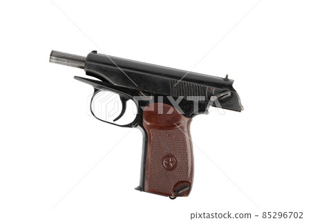 Close-up on a Makarov pistol with the bolt stopped in the open position against a white background. Close-up on a Makarov pistol with the bolt stopped in the open position against a white background. 85296702