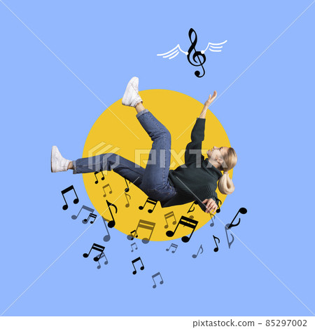 Contemporary art collage of young girl falling into music notes isolated over blue background 85297002