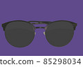 Sunglasses. Black sunglasses, close-up. Sun glasses. Old style sunglasses. Glasses with dark lenses. Vintage sun glasses on ultra violet color background. Close up of worn out sunglasses. Horizonatal 85298034