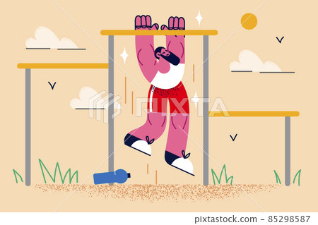 Toned sportsman do pull-up on bar outdoors Toned sportsman do pull-up on bar outdoors 85298587