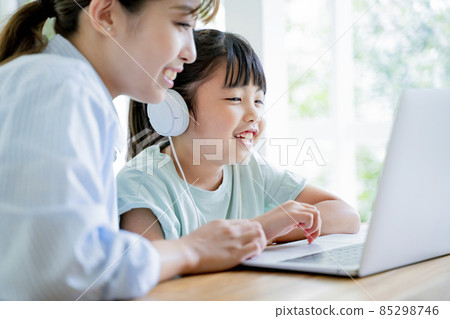 Kids studying online at home Kids studying online at home 85298746