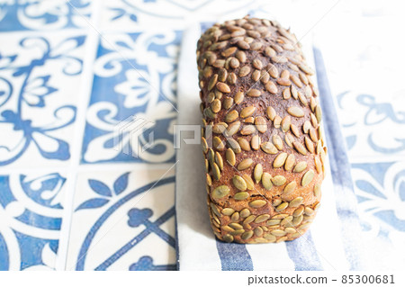 Healthy rye sourdough loaf with pumpkin seeds. 85300681