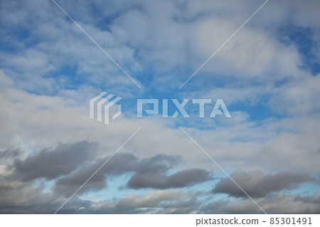 The blue sky is visible through a veil of gray clouds Atmosphere 85301491