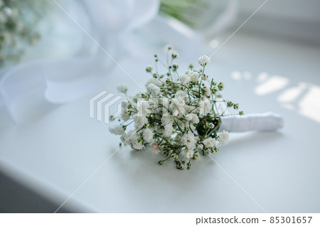 Groom boutonniere on white background Groom boutonniere on white background 85301657