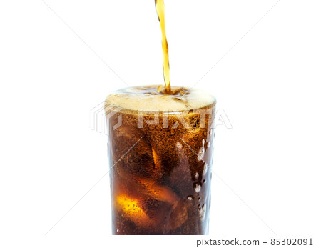 Solt drink being poures into a glass with ice Solt drink being poures into a glass with ice 85302091