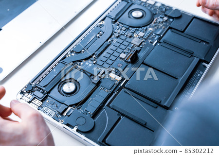 Maintenance pc. Maintenance repair engineer support. Computer technician service with laptop on hardware background. Electronic technology development concept. 85302212