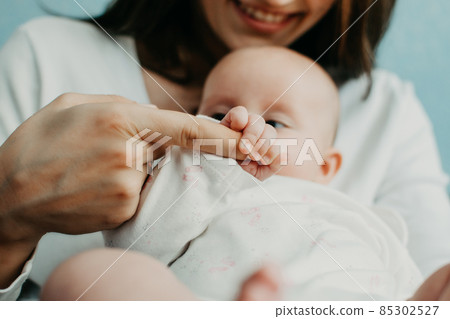 Mental Health in Postpartum Time. Maternal Mental Health. How to avoid pregnancy And Postpartum Disorders, postpartum baby blues, depression. Portrait of happy mother and newborn baby Mental Health in Postpartum Time. Maternal Mental Health. How to avoid pregnancy And Postpartum Disorders, postpartum baby blues, depression. Portrait of happy mother and newborn baby 85302527
