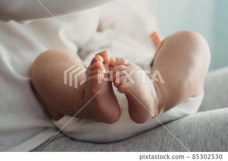 Newborn Baby Skin Care. Close up of Baby feet. Feet of newborn baby. Happy family and parenthood 85302530