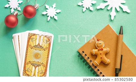 Tarot cards in Christmas decoration. Esoteric, fortune telling and predictions 85302580