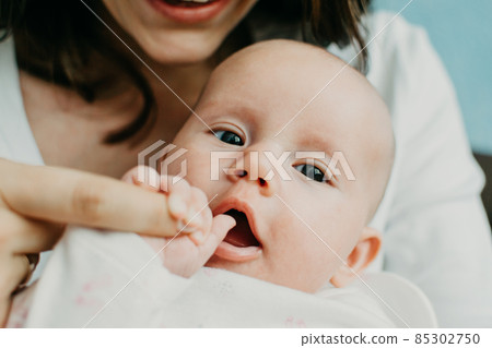 Mental Health in Postpartum Time. Maternal Mental Health. How to avoid pregnancy And Postpartum Disorders, postpartum baby blues, depression. Portrait of happy mother and newborn baby Mental Health in Postpartum Time. Maternal Mental Health. How to avoid pregnancy And Postpartum Disorders, postpartum baby blues, depression. Portrait of happy mother and newborn baby 85302750