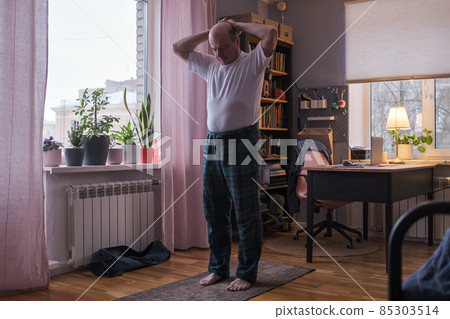 Senior man working out, yoga in basic standing asana tadasana, mountain posture 85303514