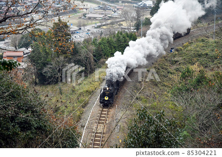 SL Yamaguchi running with the town of Tsuwano in the background SL Yamaguchi running with the town of Tsuwano in the background 85304221