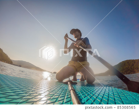 Attractive Man on Stand Up Paddle Board, SUP Attractive Man on Stand Up Paddle Board, SUP 85308565