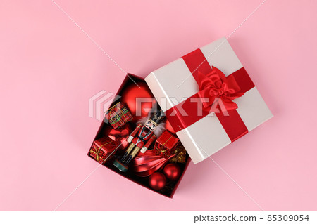 Christmas gift box and ornaments in pink background 85309054