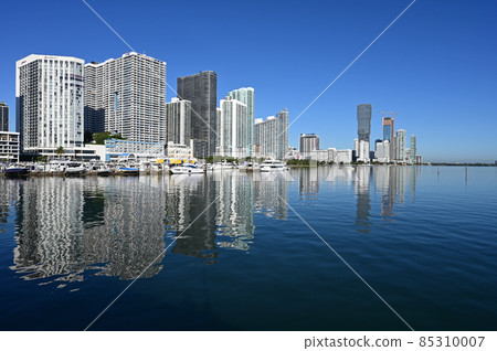 Residential waterfront towers reflected in Biscayne Bay in Miami, Florida. Residential waterfront towers reflected in Biscayne Bay in Miami, Florida. 85310007