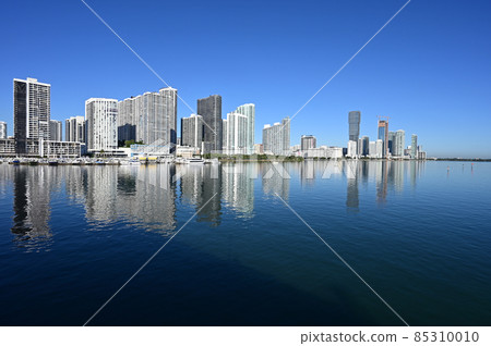 Residential waterfront towers reflected in Biscayne Bay in Miami, Florida. 85310010