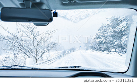 Driving the snow road Driving the snow road 85311381