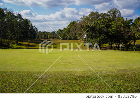 Golf course with a rich green turf beautiful scenery. Golf course with a rich green turf beautiful scenery. 85312780