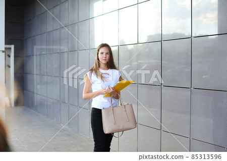 Business woman girl work business center look at documents Business woman girl work business center look at documents 85313596