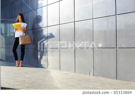 Business woman girl work business center look at documents Business woman girl work business center look at documents 85313664